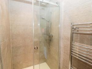 a shower with a glass door in a bathroom at Lodge 32 in Newcastle upon Tyne +22 photos