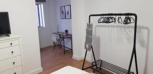 Televízia a/alebo spoločenská miestnosť v ubytovaní Apartamento cerca de la Playa de Las Canteras