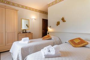 Letto o letti in una camera di Lucca Franco's Villa