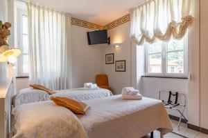 Letto o letti in una camera di Lucca Franco's Villa