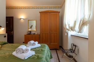Letto o letti in una camera di Lucca Franco's Villa