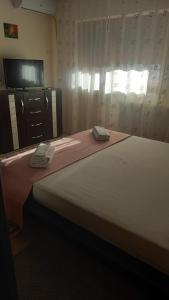 Ένα ή περισσότερα κρεβάτια σε δωμάτιο στο Cassabella