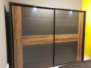 a sliding barn door in a room at A Ground Floor Maisonette - Mellieha Bay in Is-Sellum