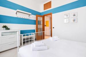 A bed or beds in a room at Luce San Lorenzo by Halldis
