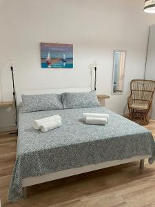 Postel nebo postele na pokoji v ubytování Aria di mare