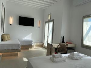 Cama ou camas em um quarto em Paolas Sunset