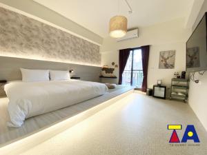 Letto o letti in una camera di Ta 溫泉會館