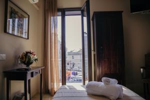 Łóżko lub łóżka w pokoju w obiekcie Le Antiche Colonne