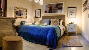 Posteľ alebo postele v izbe v ubytovaní Ajuga Luxury Boutique B&B