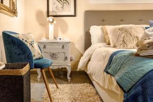 Кровать или кровати в номере Ajuga Luxury Boutique B&B