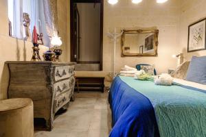 Кровать или кровати в номере Ajuga Luxury Boutique B&B