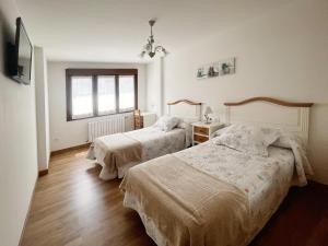 Postel nebo postele na pokoji v ubytování Apartamento Valbuena
