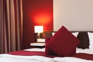 Postel nebo postele na pokoji v ubytování Weinhotel Kaisergarten