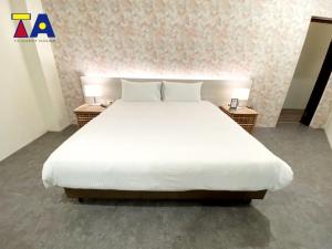 Letto o letti in una camera di Ta 溫泉會館