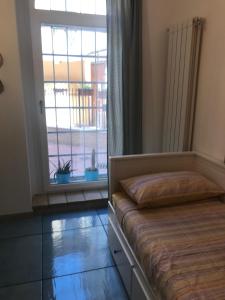 a bedroom with a bed and a large window at IL MELOGRANO La Casa nel Vicoletto in Lanciano +27 photos