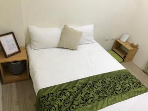 Postel nebo postele na pokoji v ubytování Four Seasons Homestay