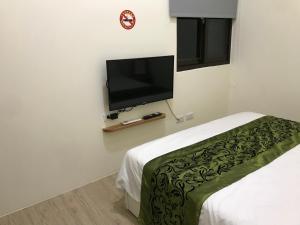 TV a/nebo společenská místnost v ubytování Four Seasons Homestay