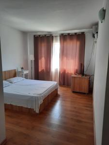 Postel nebo postele na pokoji v ubytování VILA SAMI