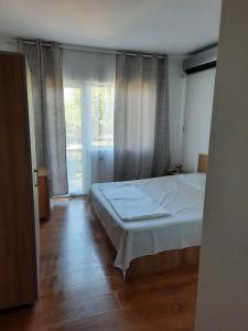 Postel nebo postele na pokoji v ubytování VILA SAMI
