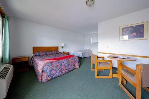 Postel nebo postele na pokoji v ubytování Budget 8 Motel