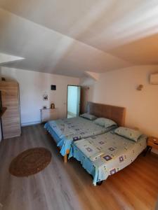 Postel nebo postele na pokoji v ubytování VILA SAMI