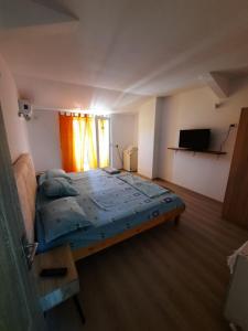 Postel nebo postele na pokoji v ubytování VILA SAMI