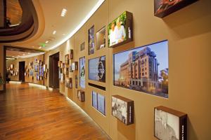 a hallway of a building with pictures on the wall at The Edgewater in Madison +27 photos