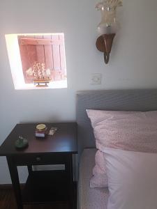 Postel nebo postele na pokoji v ubytování Apartments Hortenzija