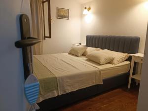 Postel nebo postele na pokoji v ubytování Apartments Hortenzija