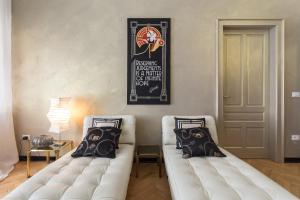 Postel nebo postele na pokoji v ubytování La casa di Gatsby Art Deco in Centro Gorizia con Parcheggio e Terrazza