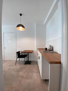 A kitchen or kitchenette at Amber Boutique Hotel