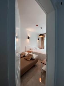 A bed or beds in a room at Amber Boutique Hotel