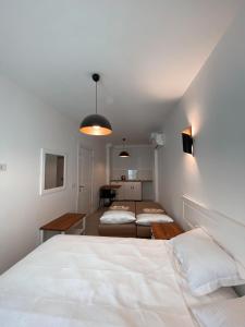 A bed or beds in a room at Amber Boutique Hotel
