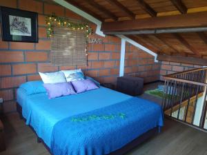 En eller flere senger på et rom på Refugio en las Nubes