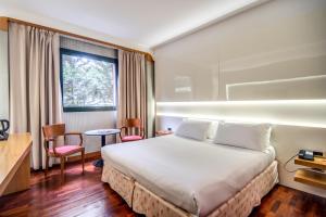 Postel nebo postele na pokoji v ubytování Hotel Della Rotonda