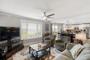 a living room with a couch and a table at HoneyHomes Spectacular View Home with Amenities in Sumner