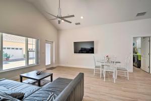 a living room with a couch and a table at Modest and Sleek Tavares Condo - 3 Mi to Dtwn! in Tavares