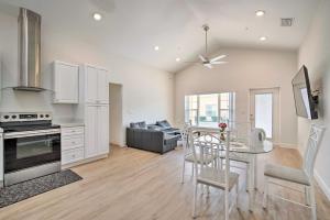 a kitchen and living room with a table and chairs at Modest and Sleek Tavares Condo - 3 Mi to Dtwn! in Tavares