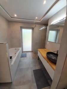 Ванная комната в Haus EDDA - Ferienwohnungen mit Garten und Schlossblick