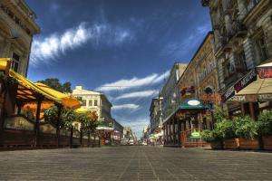 an empty street in a city with buildings at Essence Of Lodz-145m!Central-Secured-Comfy18ppl!&FreeParking in Łódź
