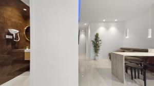 a living room with a table and chairs and a table at Seven Seas Apartments in Nazaré +35 photos