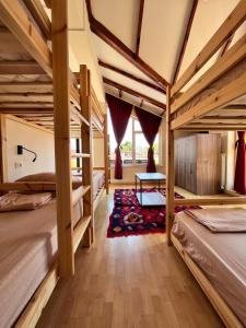 a room with bunk beds in a house at Blue Door Hostel in Tirana