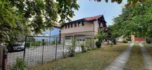 a fence in front of a house at Apartman Željo 1 in Livno