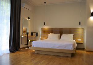 Postel nebo postele na pokoji v ubytování Theoxenia Hotel