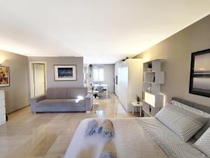 a large living room with a couch and a living room at Luxury Penthouse in the heart of Bari with terrace in Bari