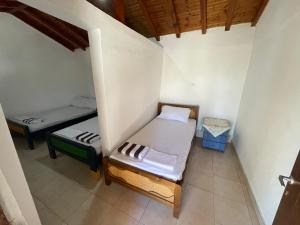 Postel nebo postele na pokoji v ubytování Alexiou Guesthouse Pilion Katigiorgis