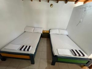 Postel nebo postele na pokoji v ubytování Alexiou Guesthouse Pilion Katigiorgis