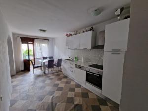 Kuchyň nebo kuchyňský kout v ubytování Eros Rooms