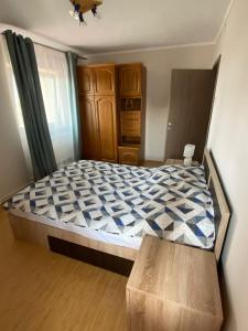 a bedroom with a large bed in a room at Sunrise Apartment in Constanţa