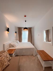 A bed or beds in a room at Amber Boutique Hotel